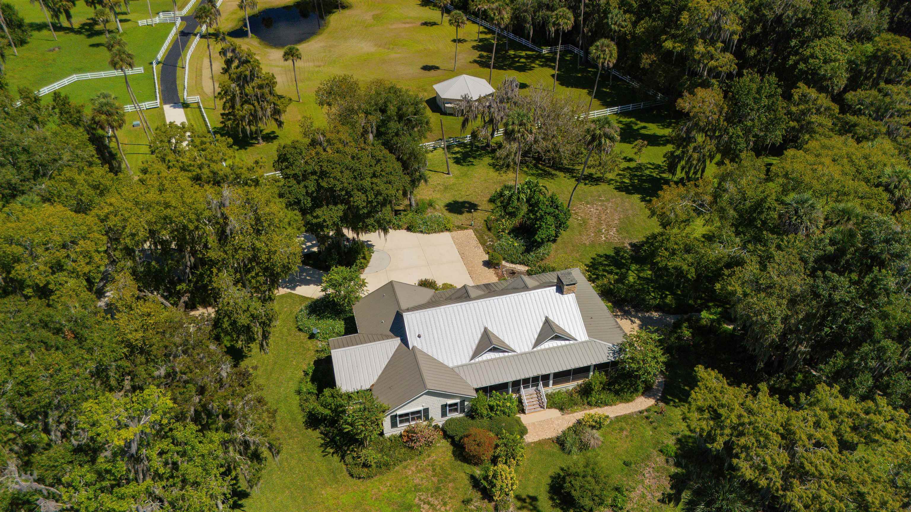141 Wooten Rd Crescent Crescent City, FL 32112 - Photo 5 of 72 an aerial view of a house with swimming pool and garden view