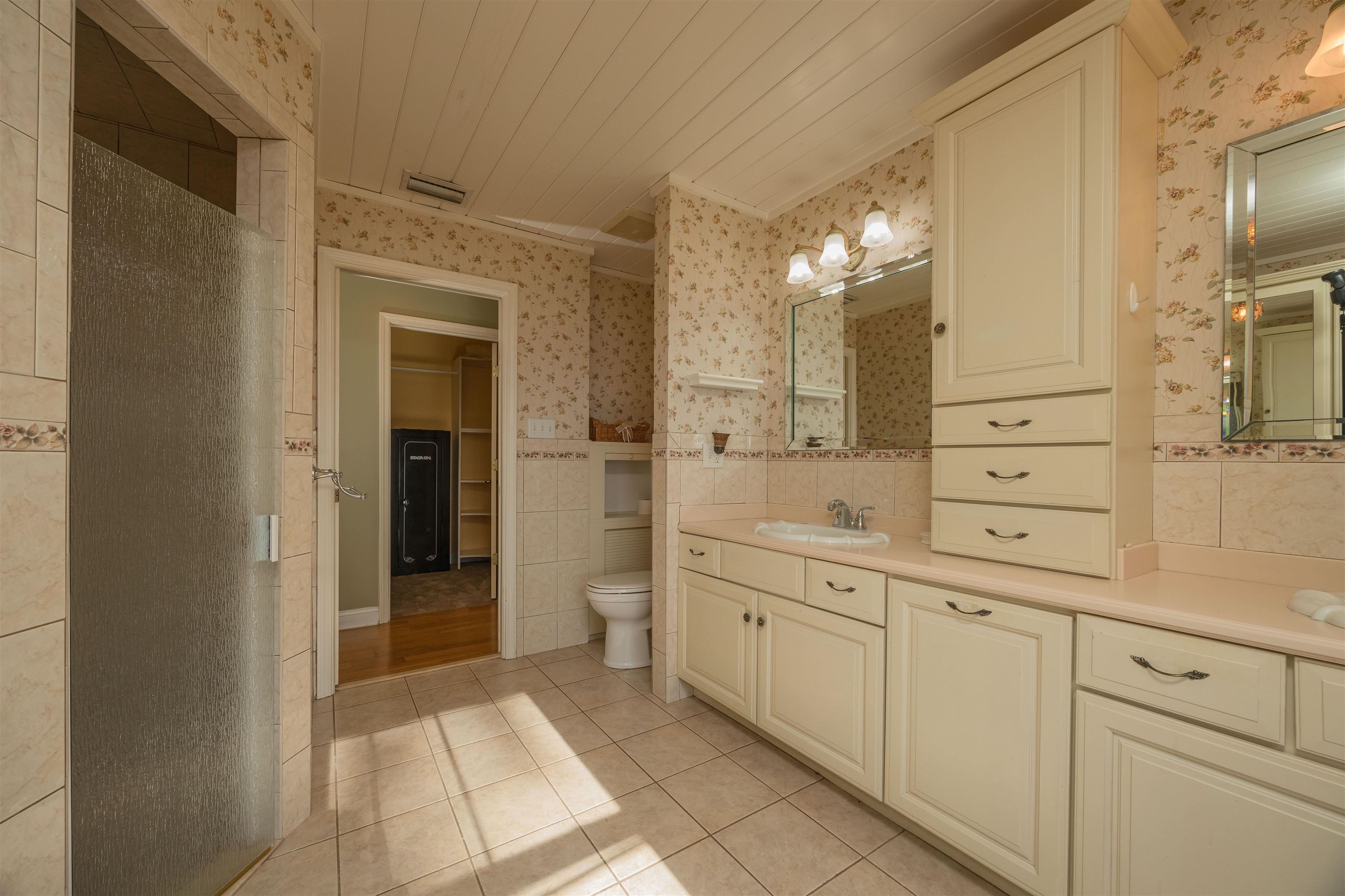 141 Wooten Rd Crescent Crescent City, FL 32112 - Photo 60 of 72 a bathroom with a shower sink and mirror