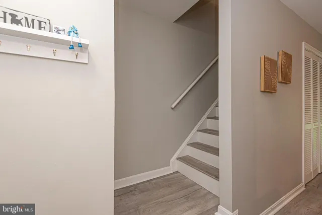 a living room with furniture a dining table and a large window