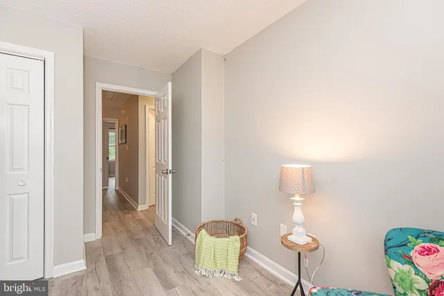 a bedroom with a bed and a table in it