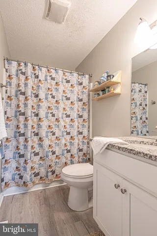 a front view of a house with a yard and a garage