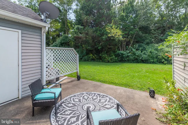 a picture of a bench in front of a building