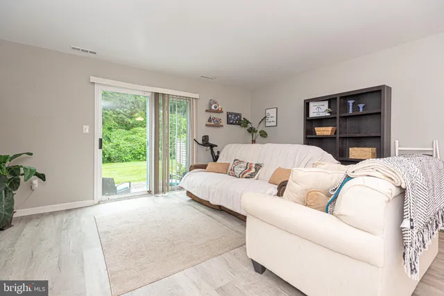 a living room with a large bed and a large window