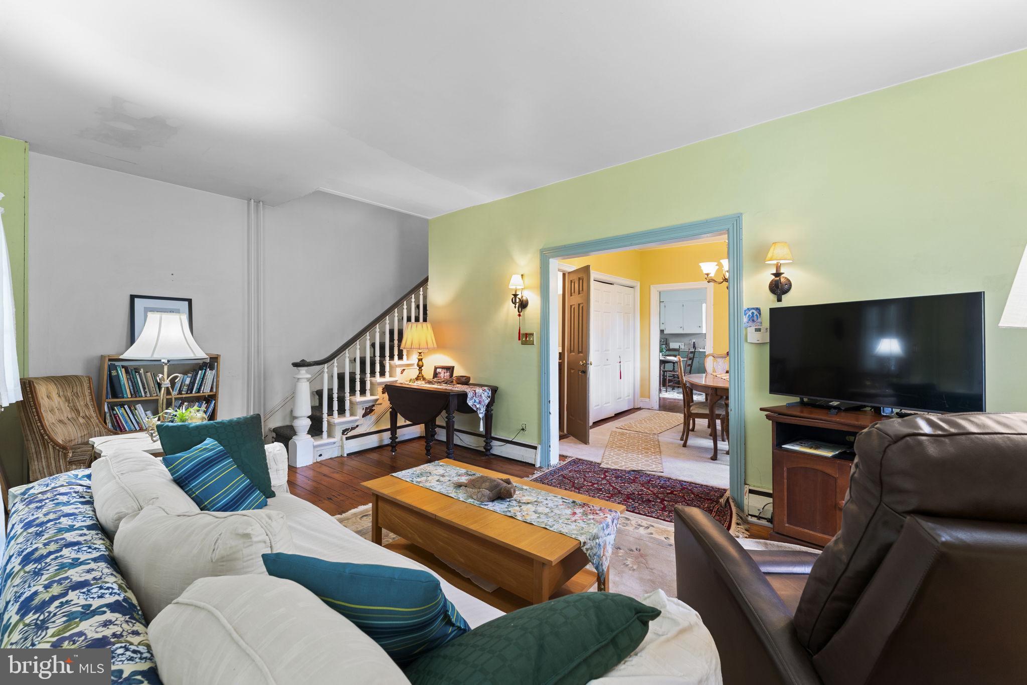 9039 Easton Road Ottsville, PA 18942 - Photo 5 of 61 a living room with furniture and a flat screen tv