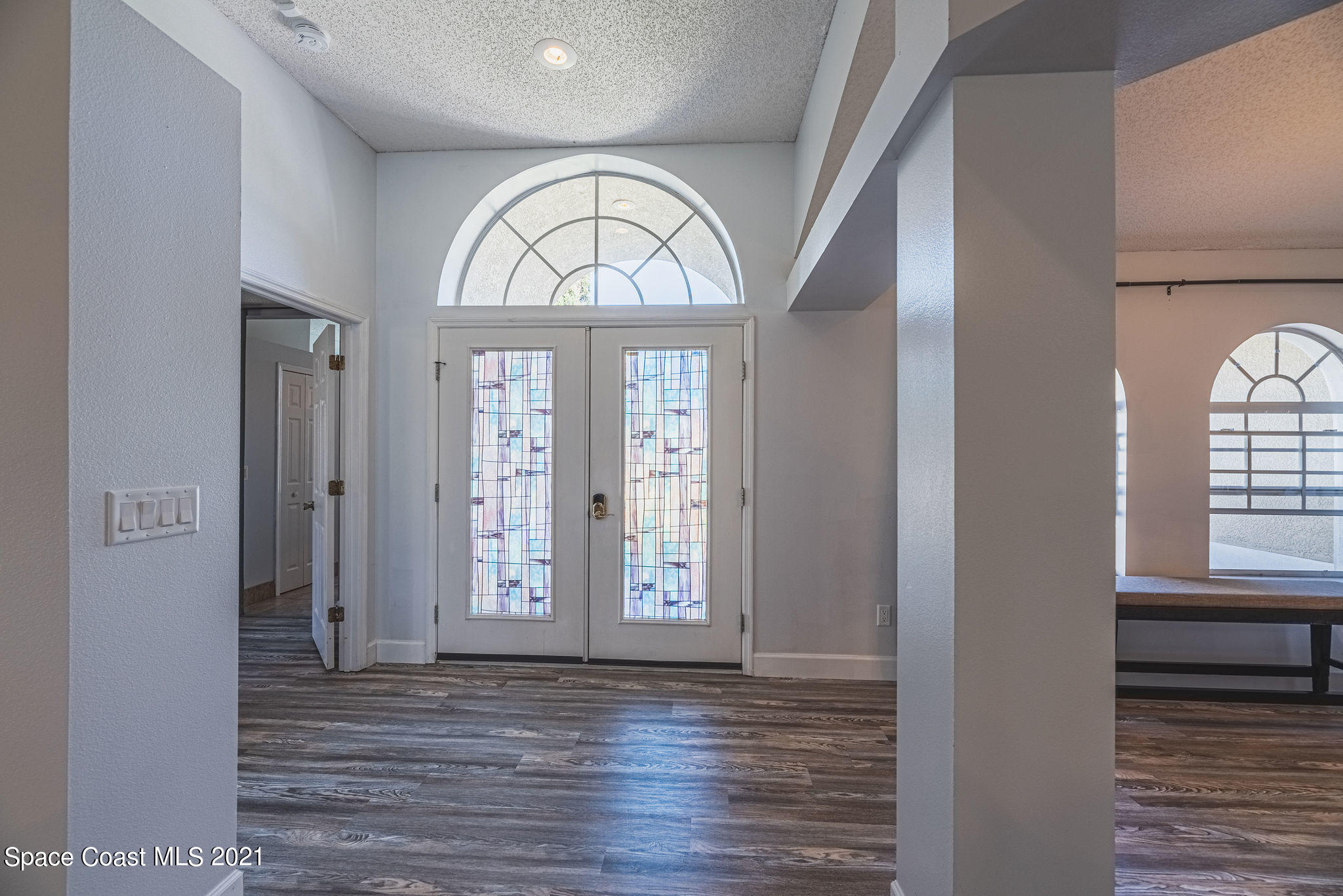 7207 Achilles Road Cocoa, FL 32927 - Photo 2 of 57 a view of an entryway with wooden floor