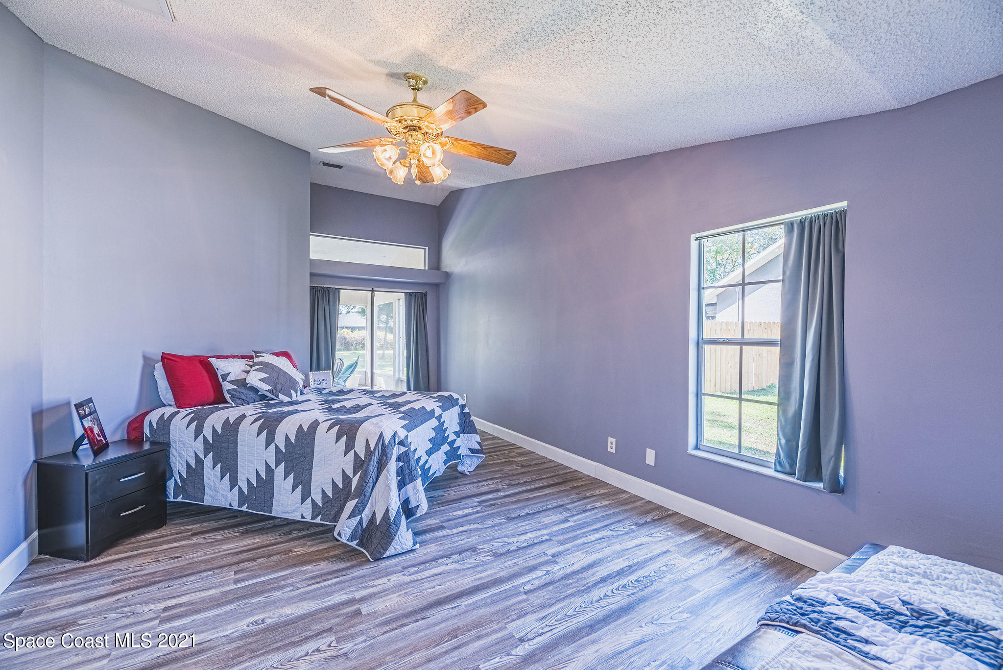 7207 Achilles Road Cocoa, FL 32927 - Photo 20 of 57 a bed sitting in a bedroom next to a window