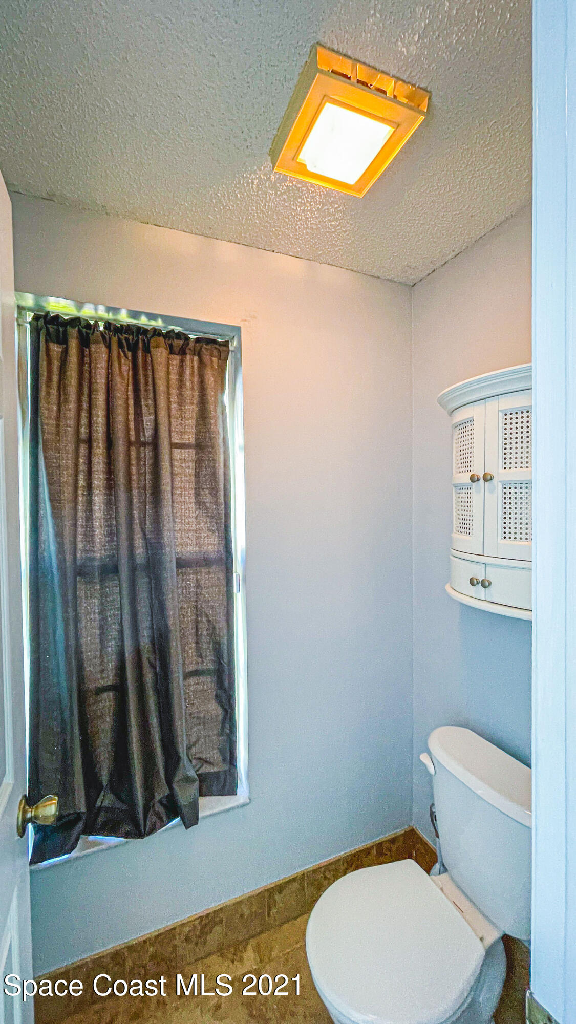 7207 Achilles Road Cocoa, FL 32927 - Photo 31 of 57 a bathroom with a toilet and a sink