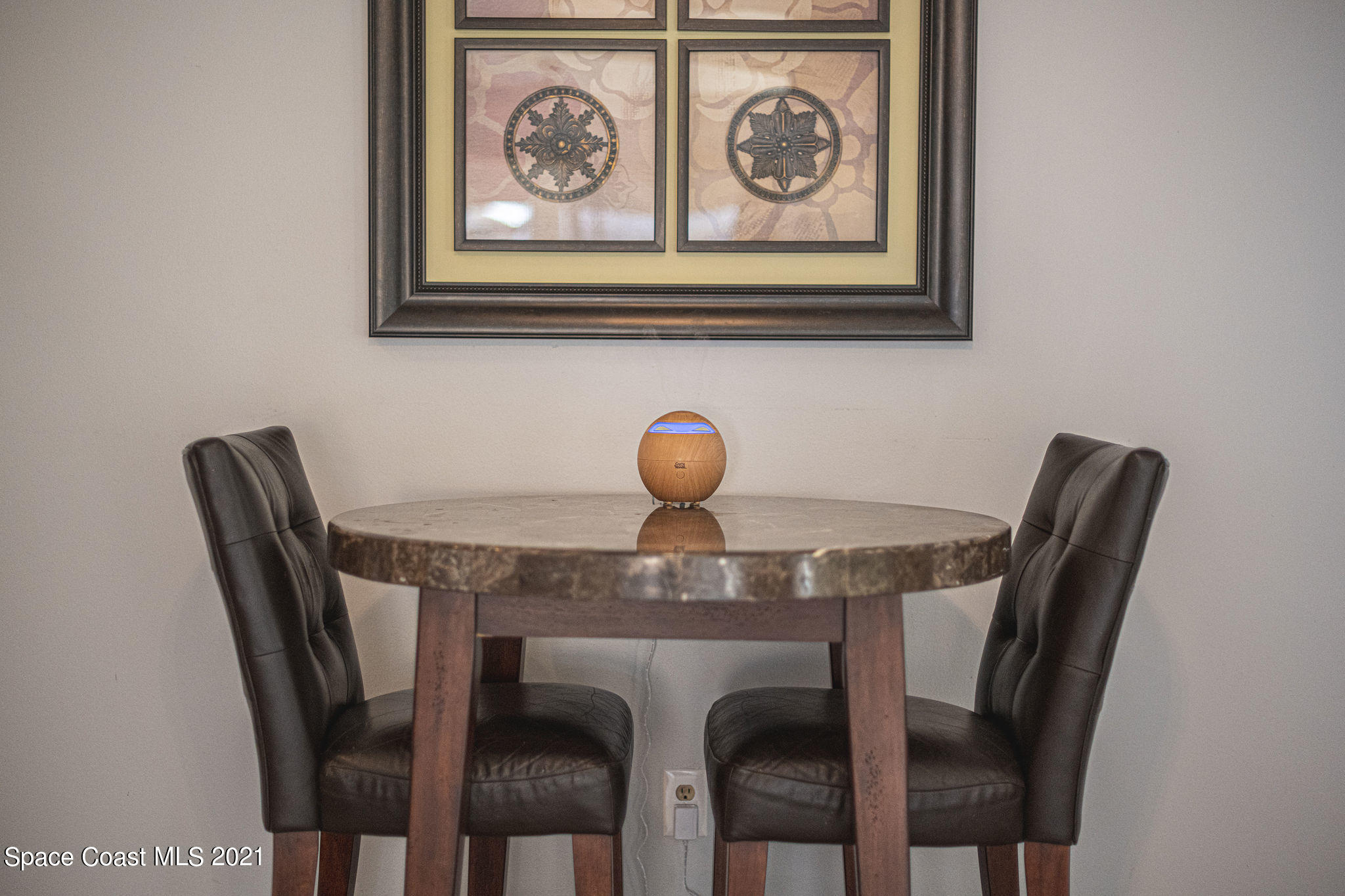 7207 Achilles Road Cocoa, FL 32927 - Photo 33 of 57 a dining room with a table and chairs