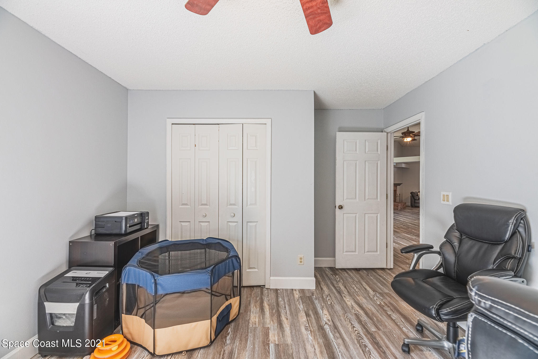 7207 Achilles Road Cocoa, FL 32927 - Photo 39 of 57 a bedroom with furniture and a couch