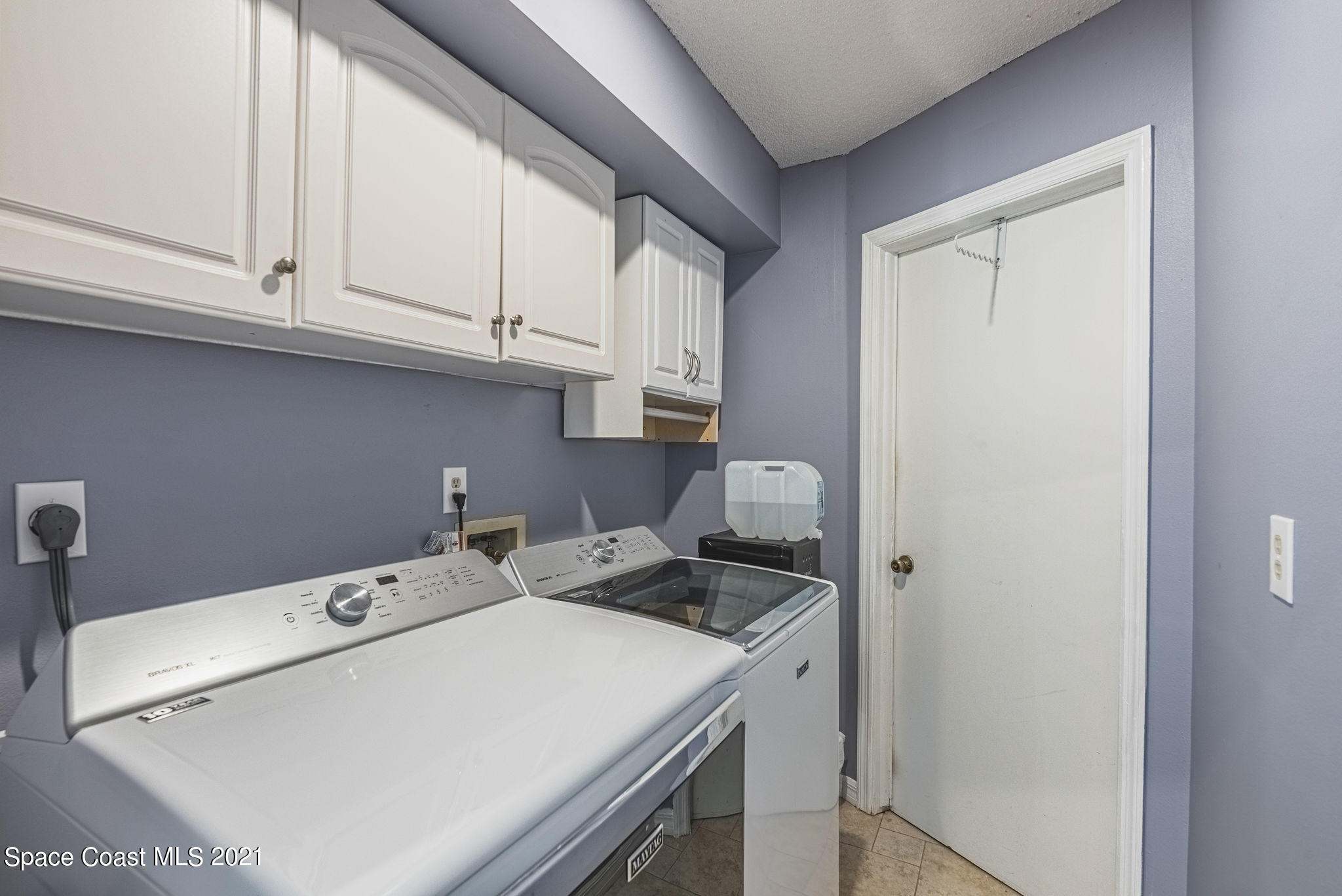 7207 Achilles Road Cocoa, FL 32927 - Photo 42 of 57 a utility room with dryer and washer