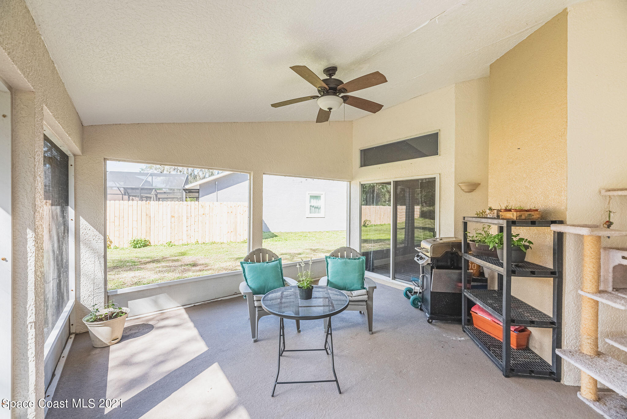 7207 Achilles Road Cocoa, FL 32927 - Photo 43 of 57 a living room with furniture and a large window