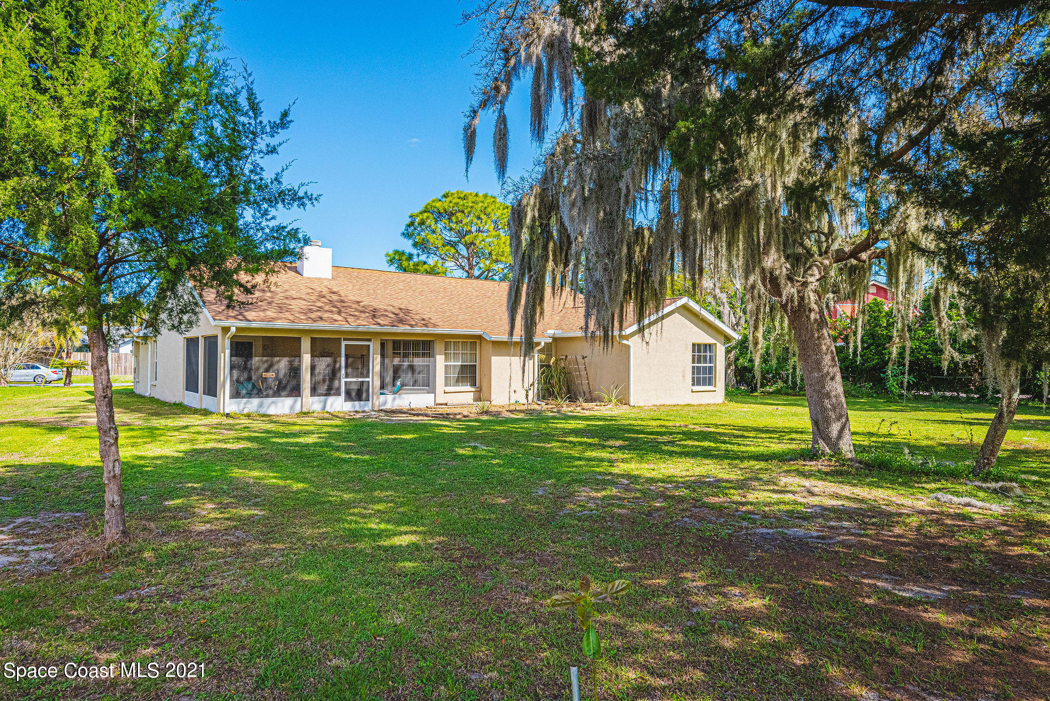 7207 Achilles Road Cocoa, FL 32927 - Photo 47 of 57 a front view of a house with a yard