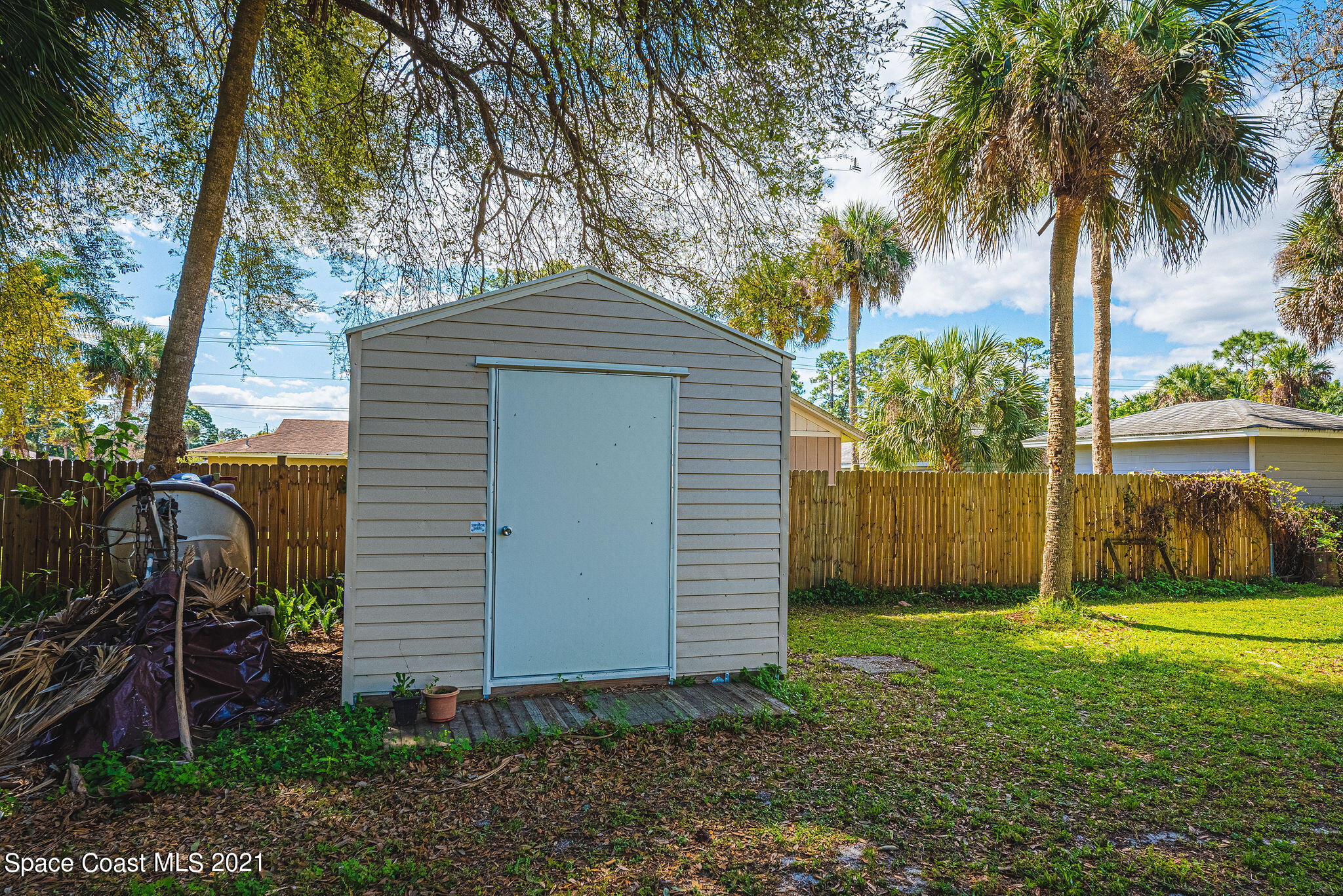 7207 Achilles Road Cocoa, FL 32927 - Photo 50 of 57 a front view of a house with garden