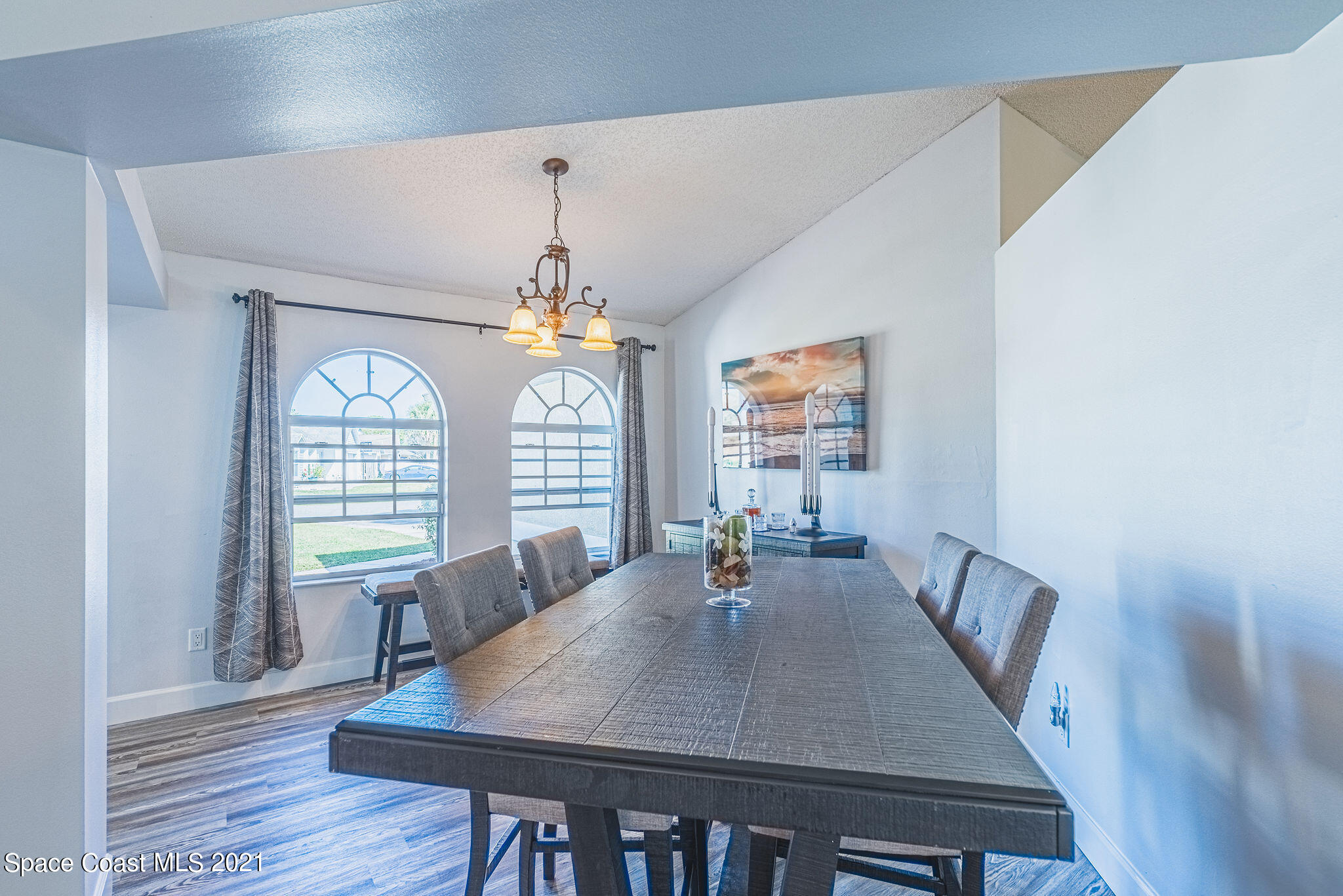 7207 Achilles Road Cocoa, FL 32927 - Photo 6 of 57 a view of a dining room with furniture window and wooden floor
