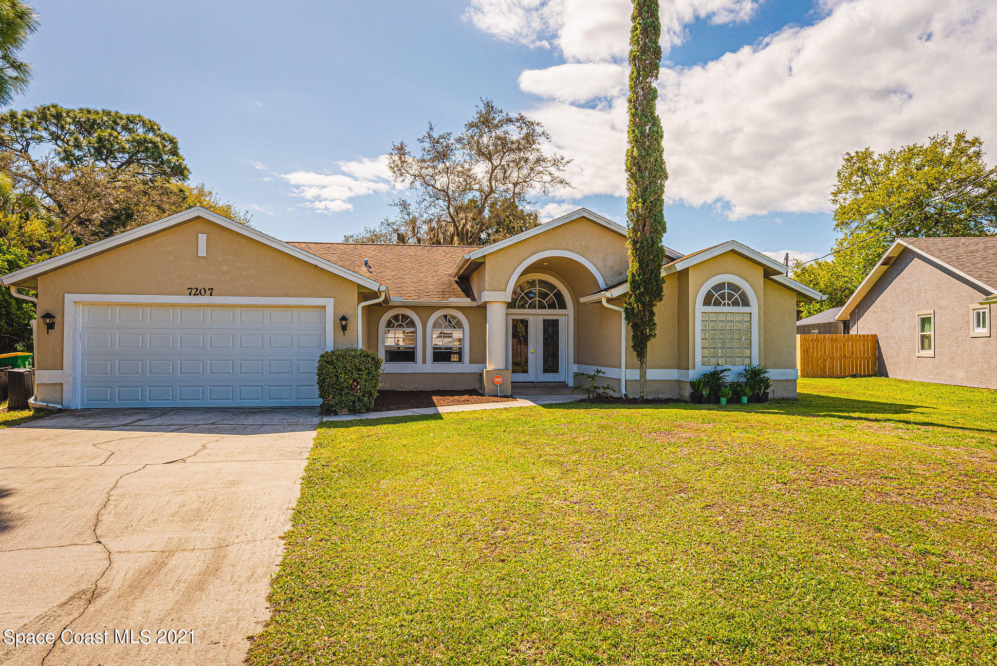 7207 Achilles Road Cocoa, FL 32927 - Photo 52 of 57 a front view of house with yard and swimming pool