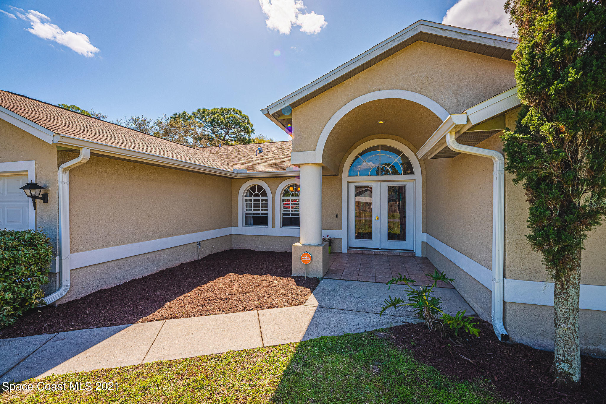 7207 Achilles Road Cocoa, FL 32927 - Photo 56 of 57 a front view of a house with garden