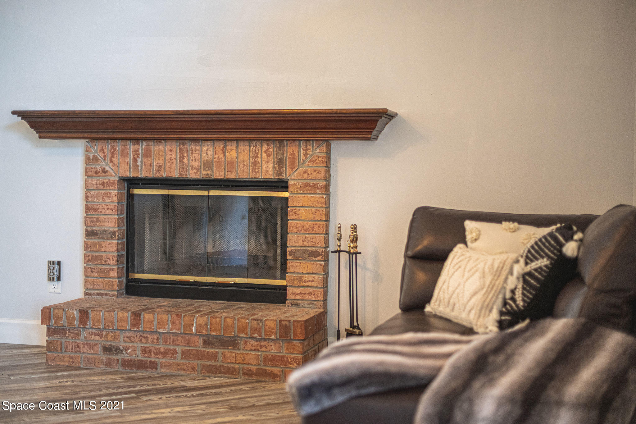 7207 Achilles Road Cocoa, FL 32927 - Photo 10 of 57 a bedroom with a bed and a fireplace