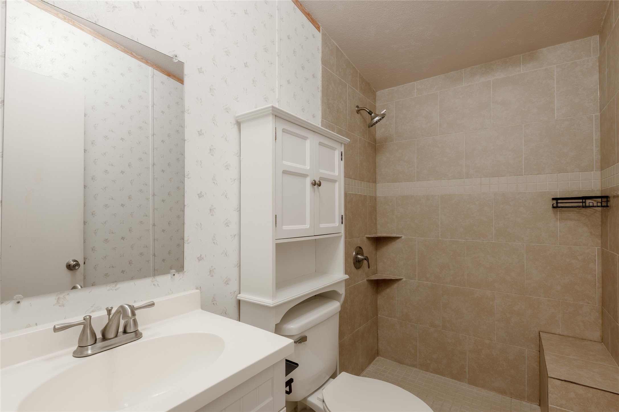 21 Oahu Court Point Blank, TX 77364 - Photo 24 of 45 Hall Bath updated with tile walk-in shower and modern vanity