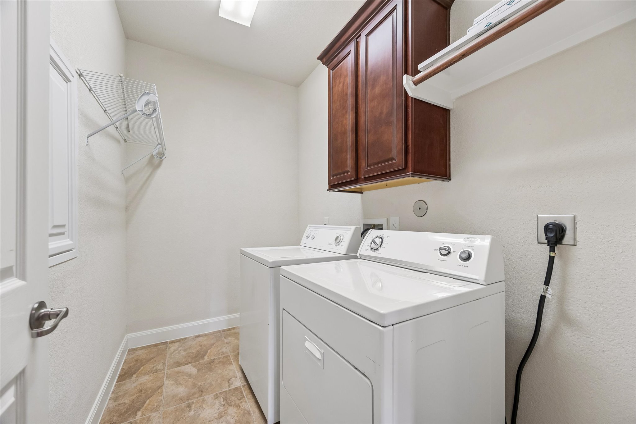 2214 Wembley Way Rosenberg, TX 77471 - Photo 33 of 35 Dedicated laundry space featuring neutral-toned tile flooring