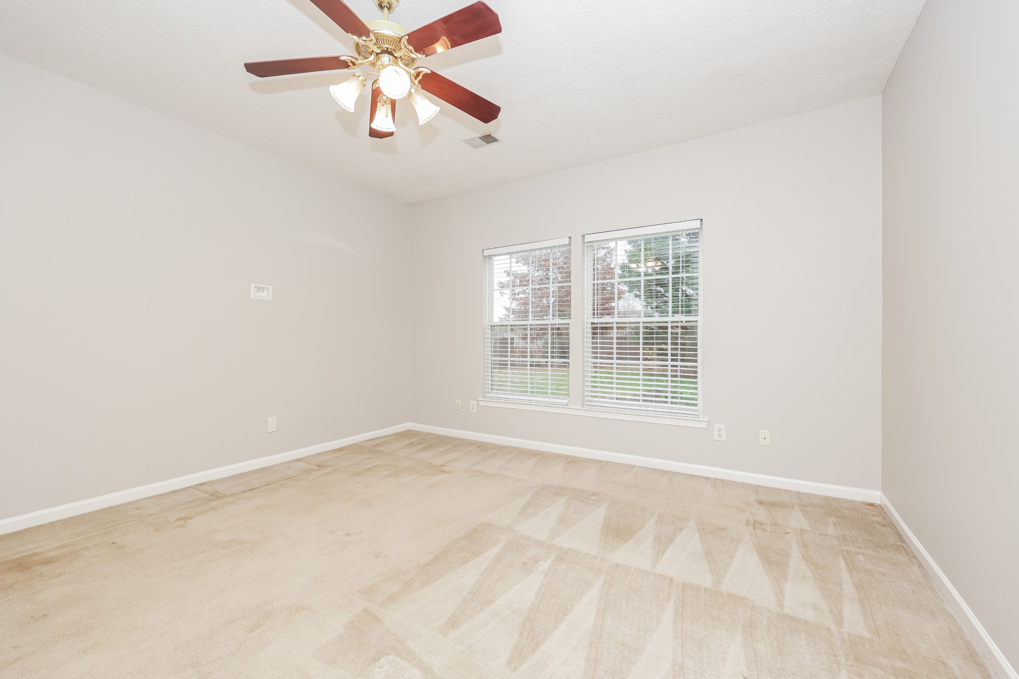1006 Prince Street Spring Hill, TN 37174 - Photo 13 of 27 a view of an empty room with window and a kitchen