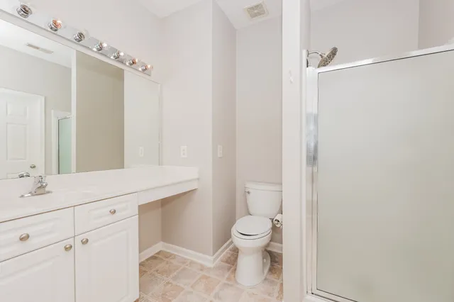 a bathroom with a tub a sink and a window
