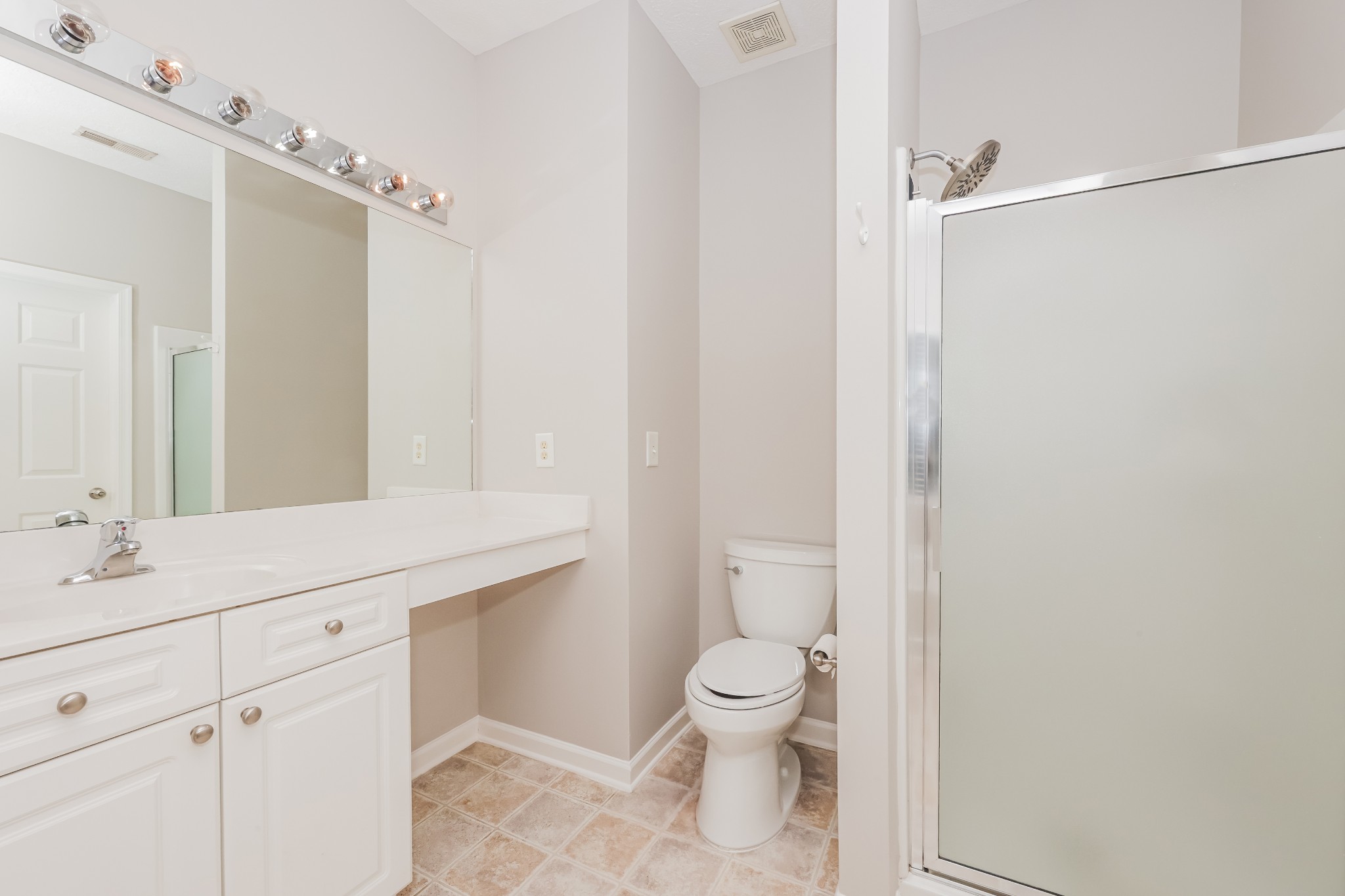 1006 Prince Street Spring Hill, TN 37174 - Photo 14 of 27 a bathroom with a granite countertop sink toilet and shower