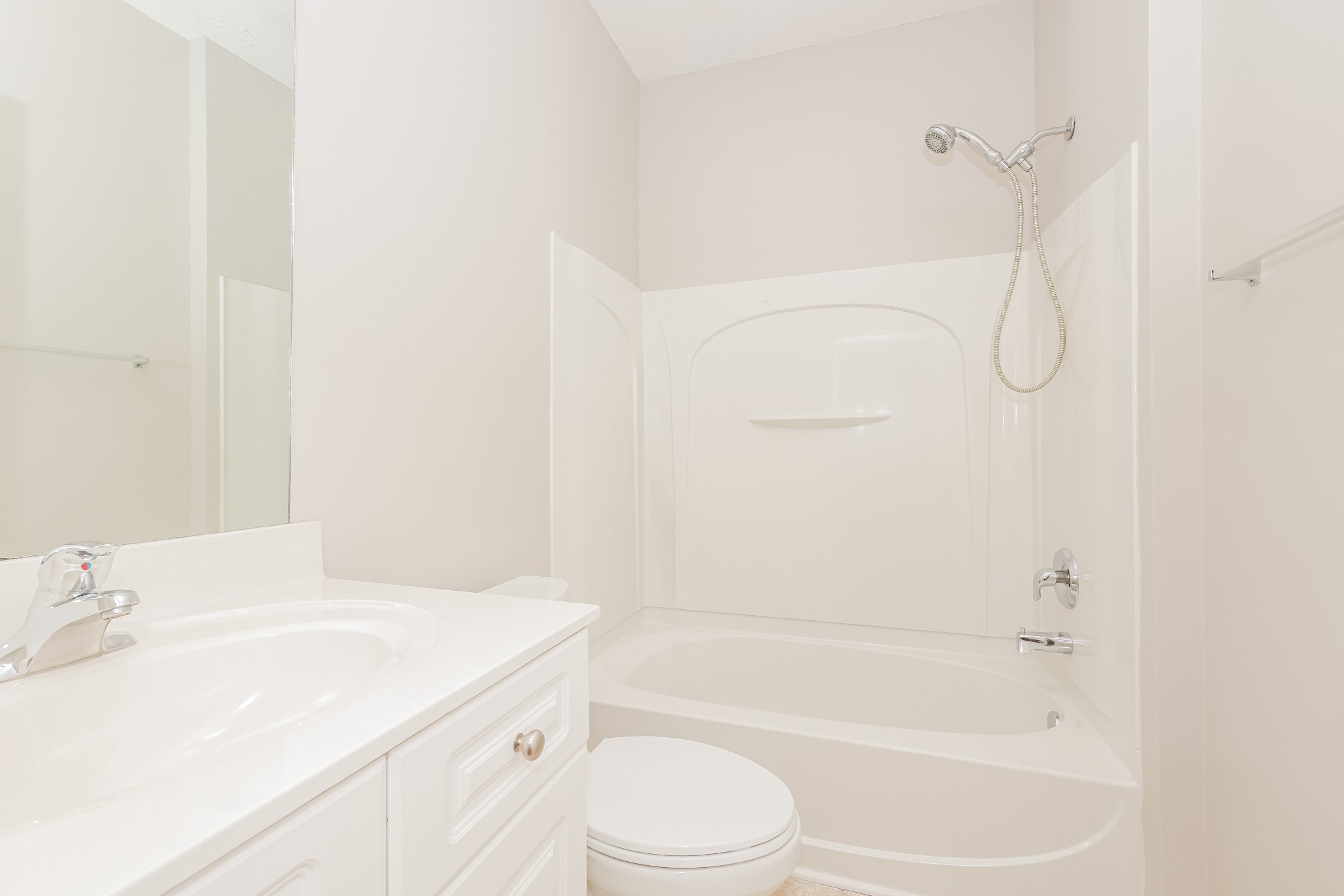 1006 Prince Street Spring Hill, TN 37174 - Photo 20 of 27 a bathroom with a granite countertop sink a toilet and shower