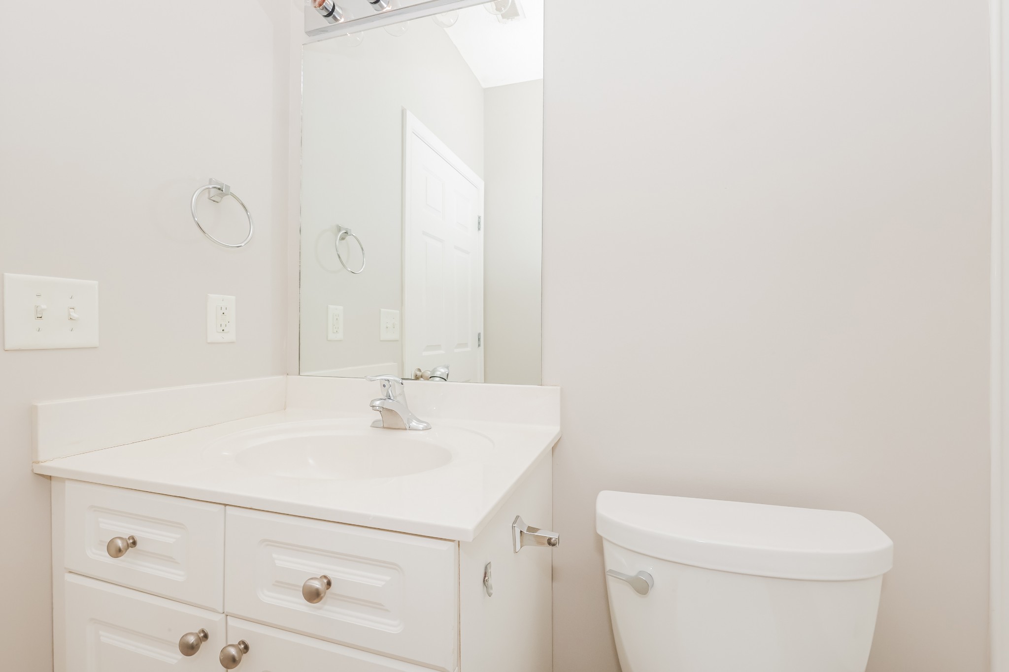 1006 Prince Street Spring Hill, TN 37174 - Photo 21 of 27 a bathroom with a sink a toilet and mirror