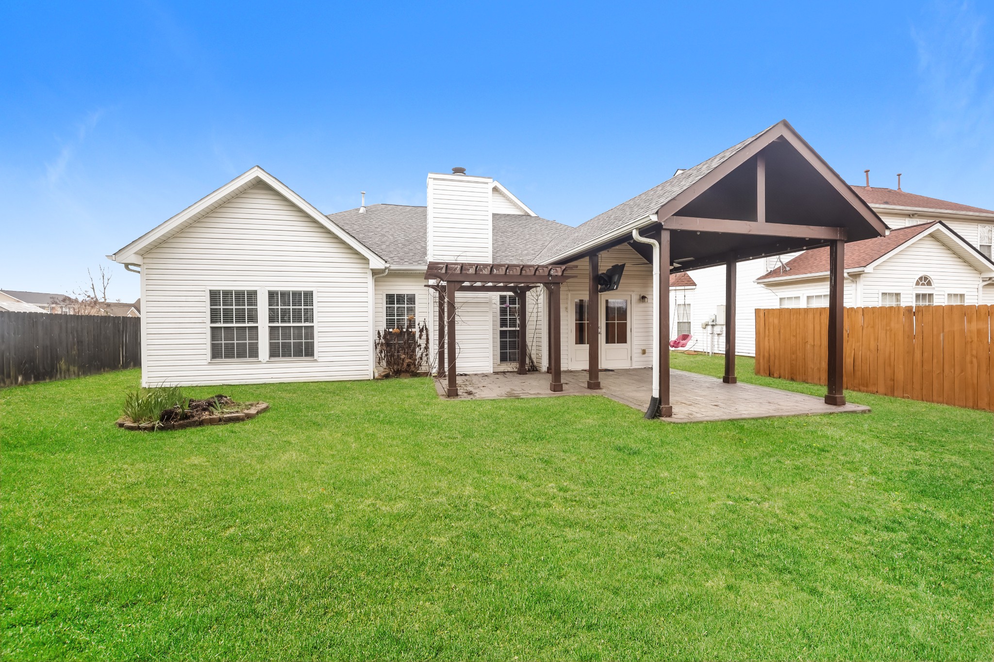 1006 Prince Street Spring Hill, TN 37174 - Photo 25 of 27 a view of a house with backyard and garden