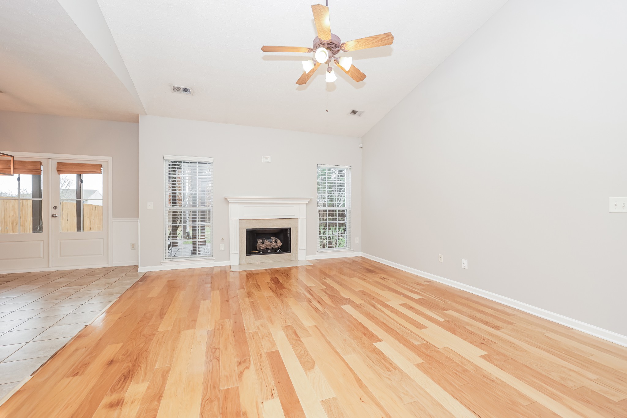 1006 Prince Street Spring Hill, TN 37174 - Photo 4 of 27 a view of empty room with fireplace and fan