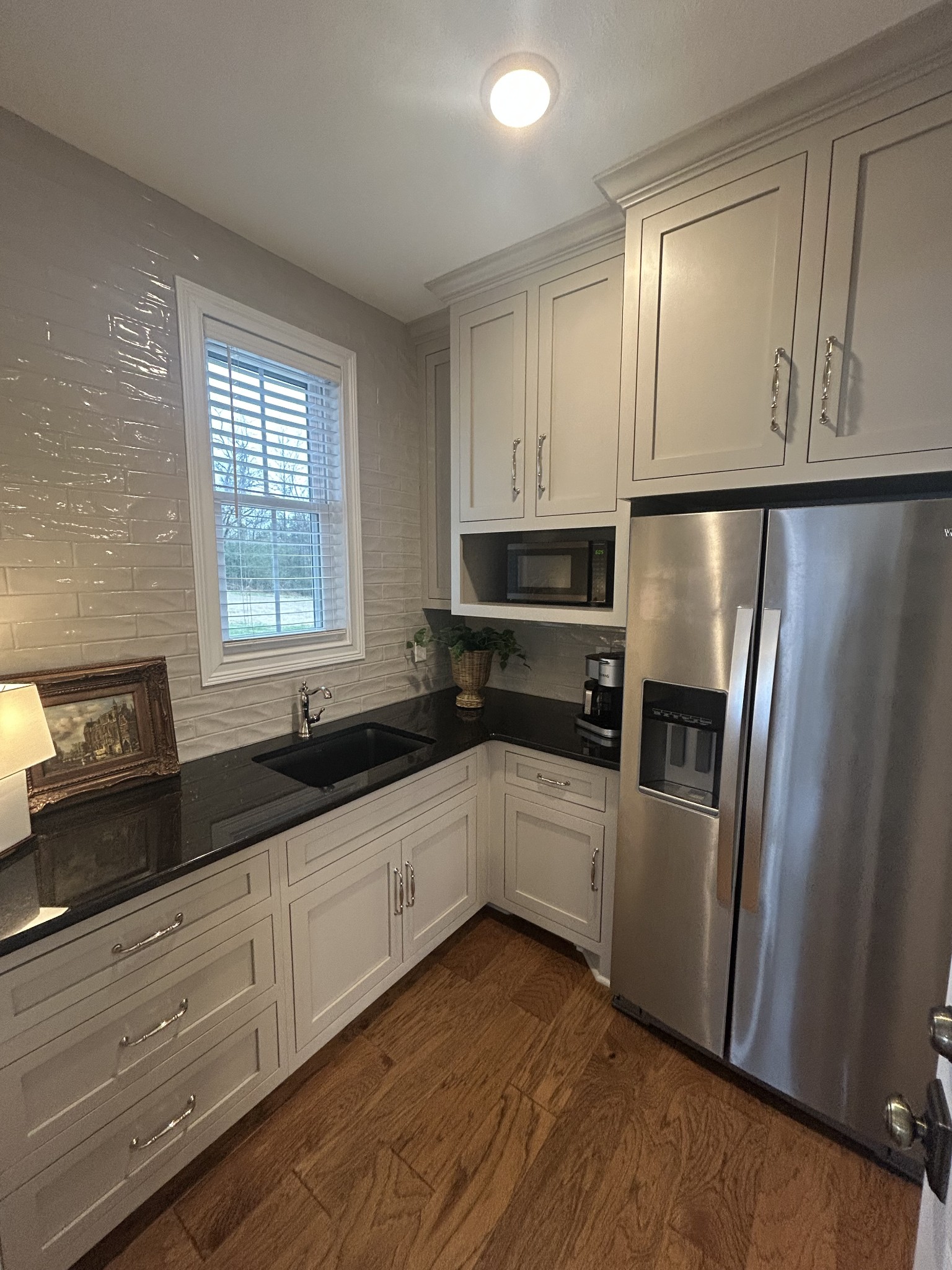3755 McFall Road Palmyra, TN 37142 - Photo 14 of 18 a kitchen with granite countertop a refrigerator sink and cabinets