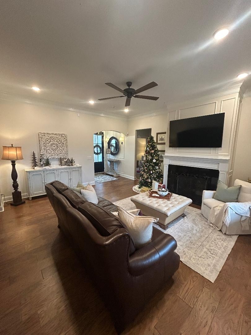 3755 McFall Road Palmyra, TN 37142 - Photo 4 of 18 a living room with furniture a flat screen tv and a fireplace