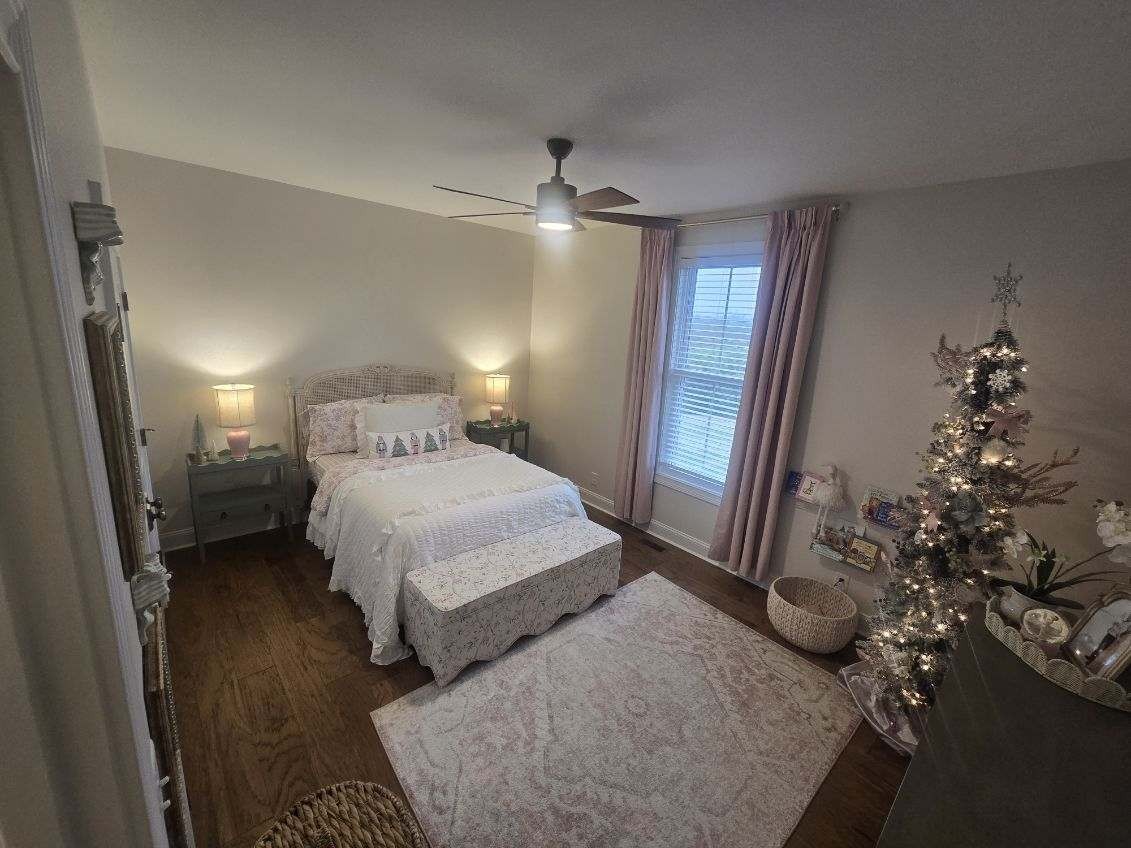 3755 McFall Road Palmyra, TN 37142 - Photo 6 of 18 a bedroom with a bed and a chandelier