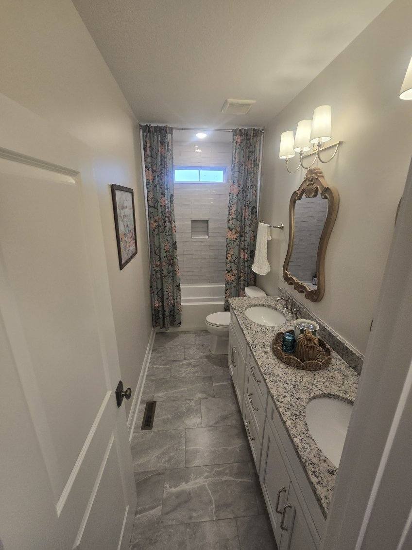 3755 McFall Road Palmyra, TN 37142 - Photo 9 of 18 a bathroom with a sink a toilet and mirror