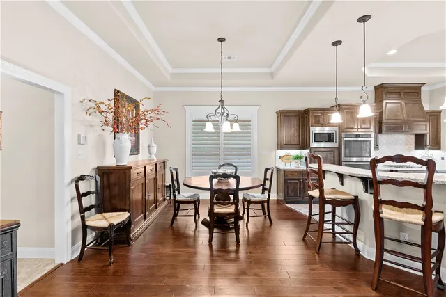 a dining room with furniture window wooden floor