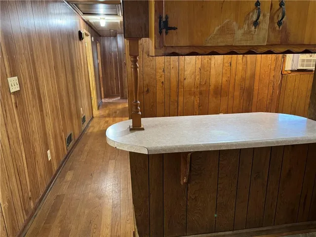 a bathroom with mirror and shower