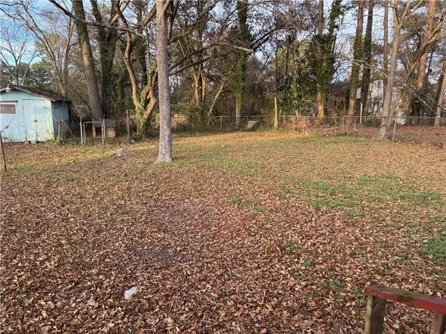 a view of kitchen with cabinets