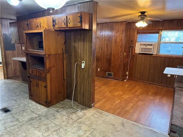 a kitchen with wooden cabinets and sink