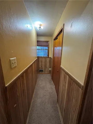 a kitchen with wooden cabinets and sink