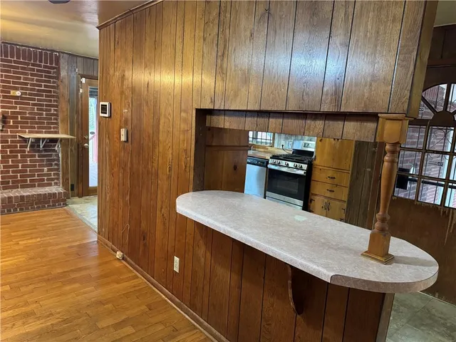 a bathroom with a sink a toilet a mirror and bathtub