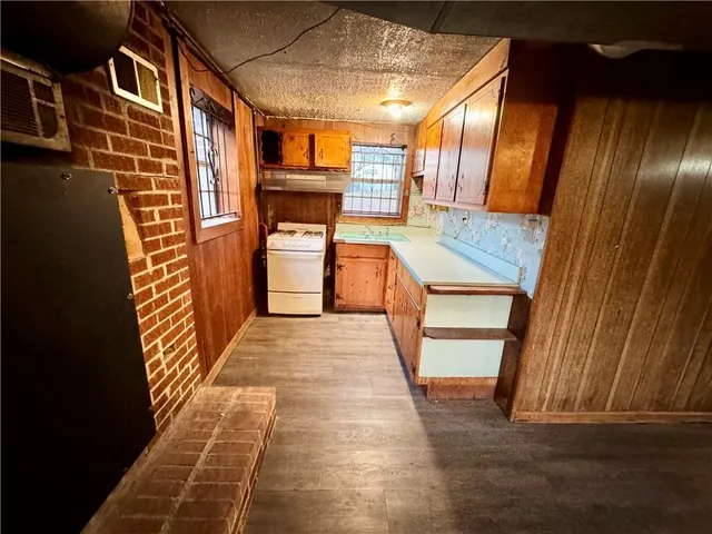 a utility room with sink dryer and washer