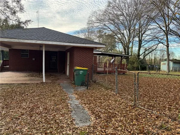 a backyard of a house with seating space