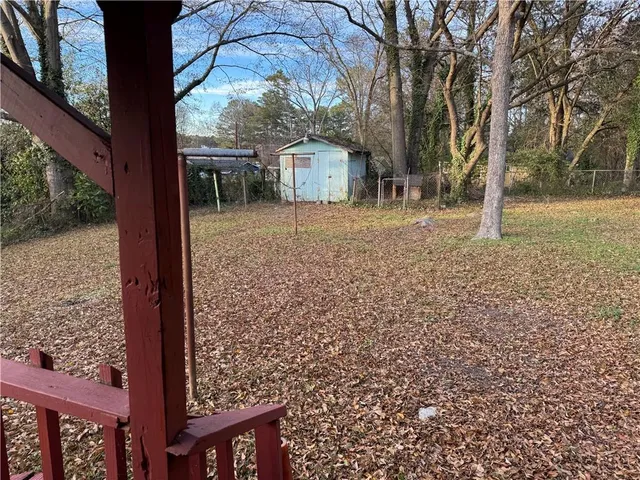 a backyard of a house with lots of green space