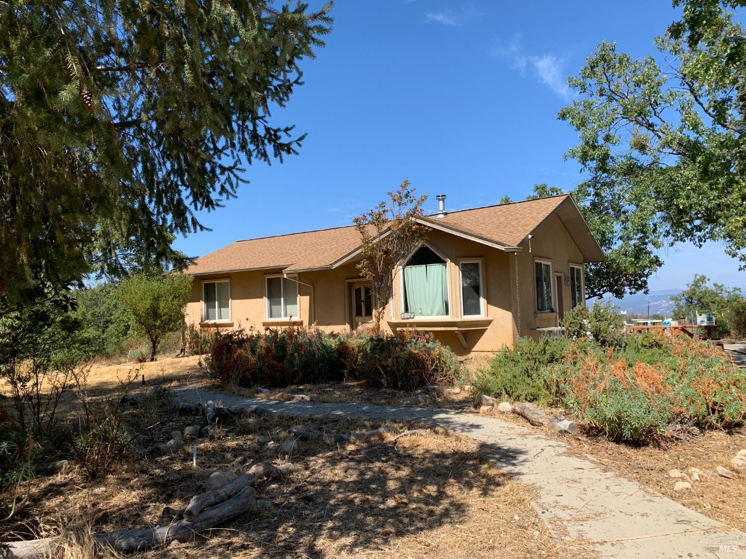 9185 Gray Road Middletown, CA 95461 - Photo 1 of 1 a front view of a house with a yard
