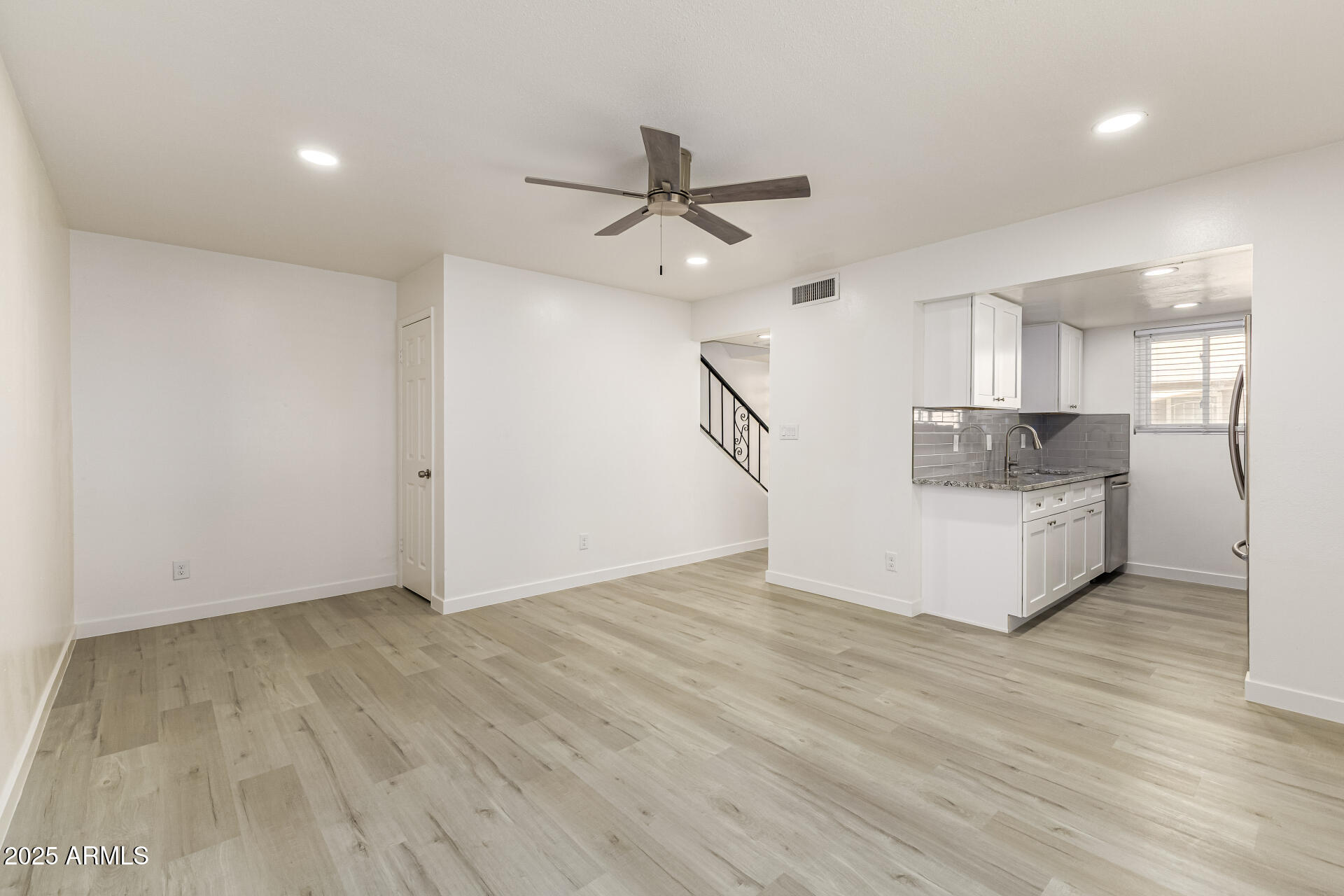 7126 North 19th Avenue, Unit 224 Phoenix, AZ 85021 - Photo 10 of 37 a view of a kitchen with a sink and a ceiling fan