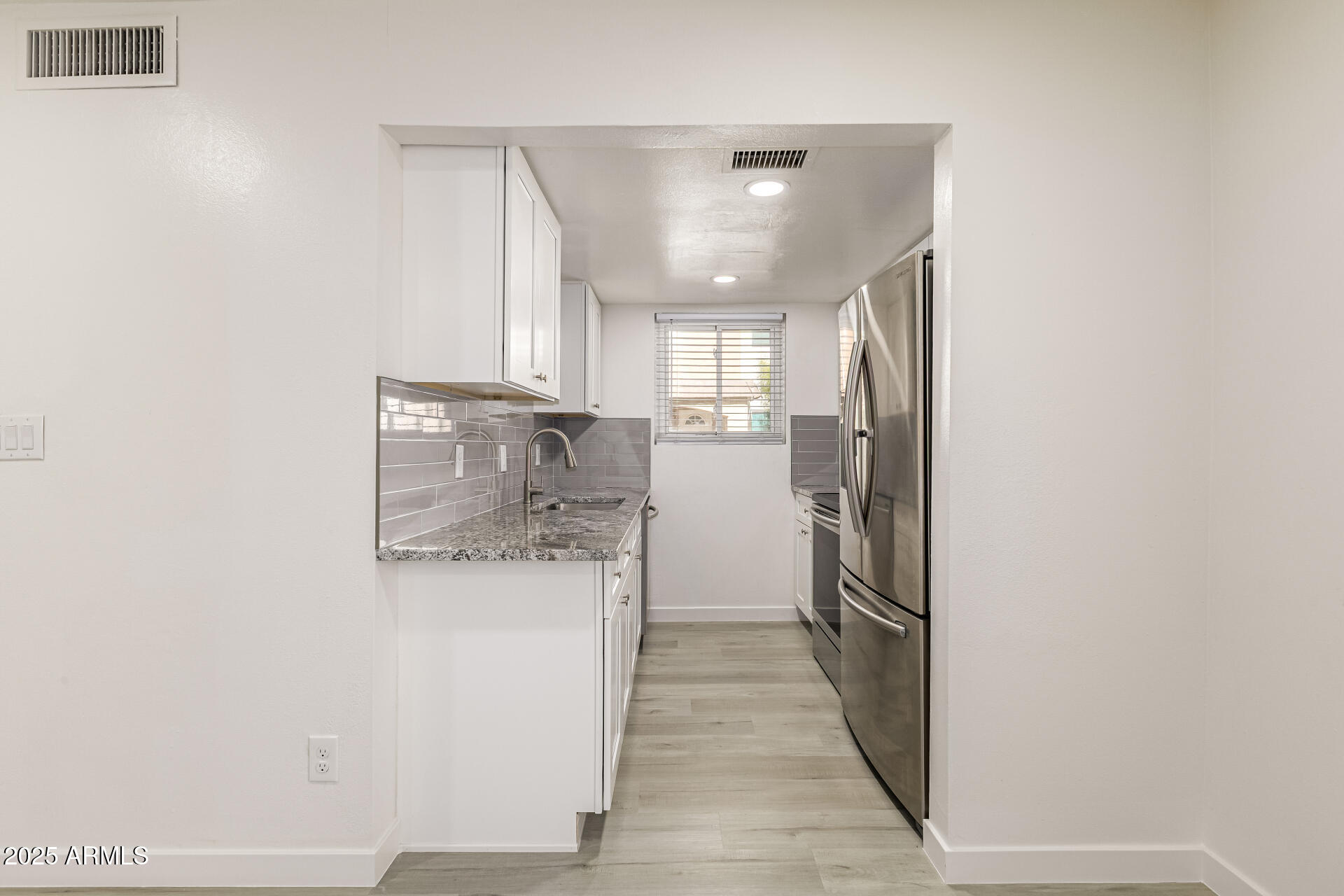 7126 North 19th Avenue, Unit 224 Phoenix, AZ 85021 - Photo 13 of 37 a kitchen with a refrigerator and a sink