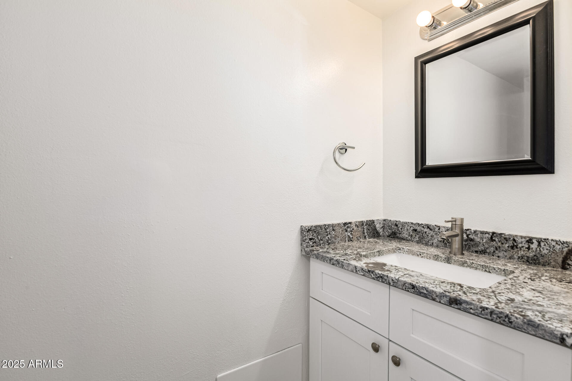 7126 North 19th Avenue, Unit 224 Phoenix, AZ 85021 - Photo 17 of 37 a bathroom with a sink and mirror