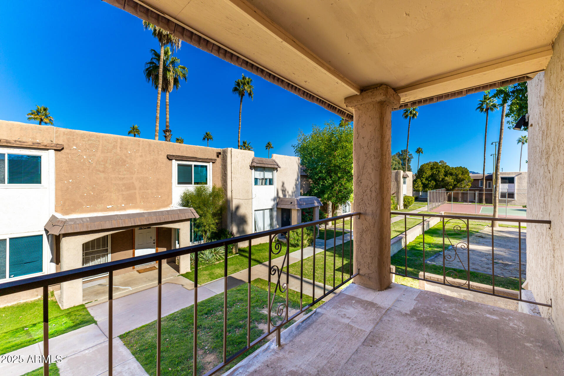 7126 North 19th Avenue, Unit 224 Phoenix, AZ 85021 - Photo 26 of 37 a view of a house with a porch and furniture