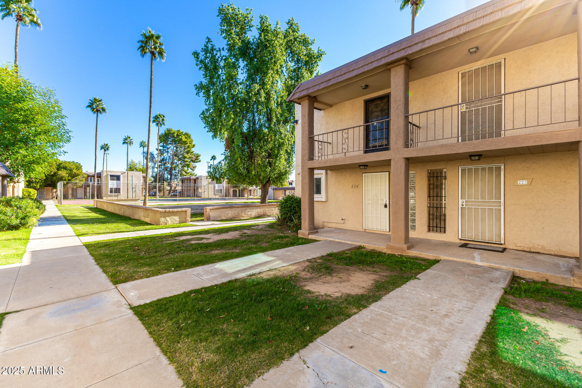 7126 North 19th Avenue, Unit 224 Phoenix, AZ 85021 - Photo 3 of 37 a front view of a house with a yard