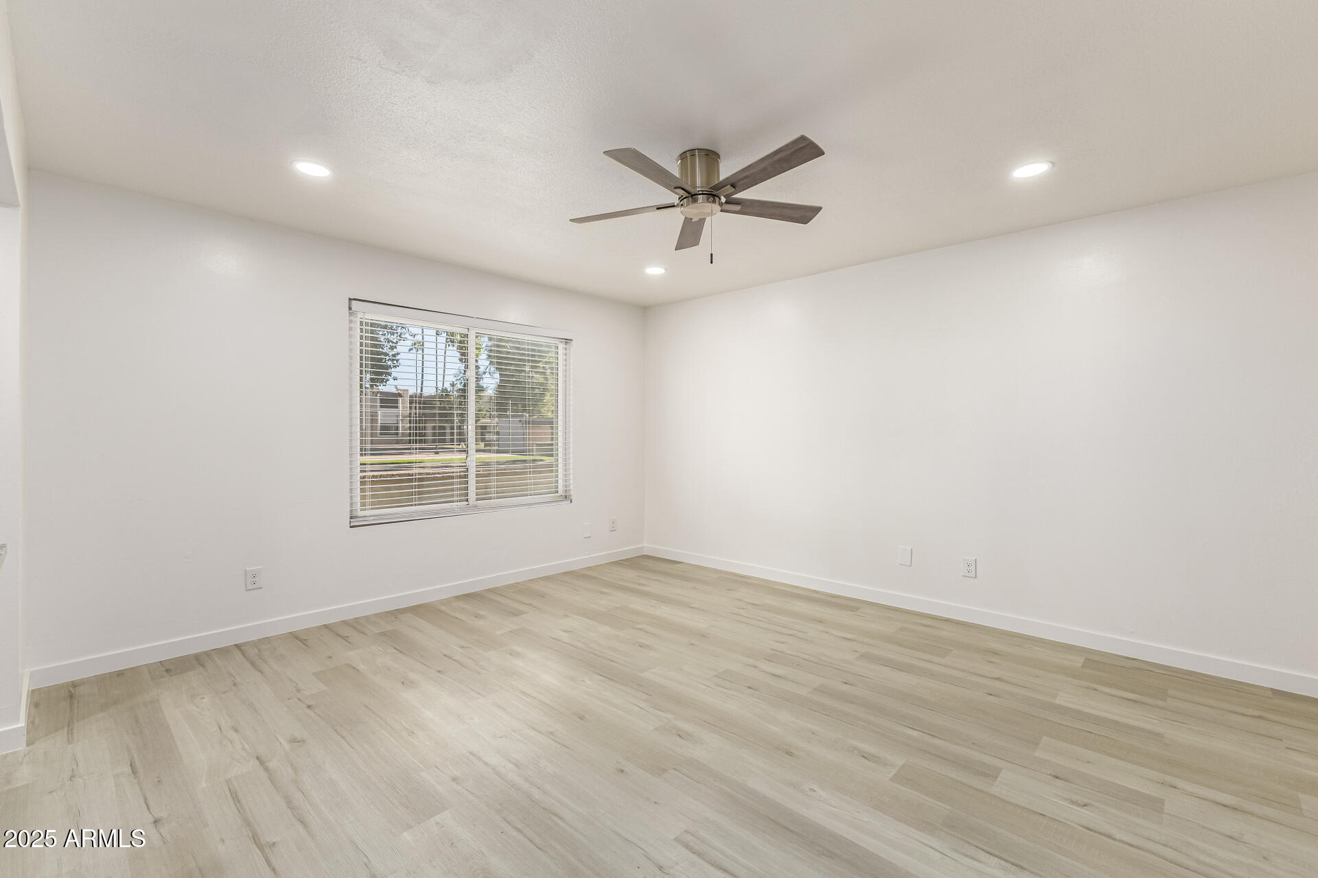 7126 North 19th Avenue, Unit 224 Phoenix, AZ 85021 - Photo 8 of 37 wooden floor in an empty room with a window